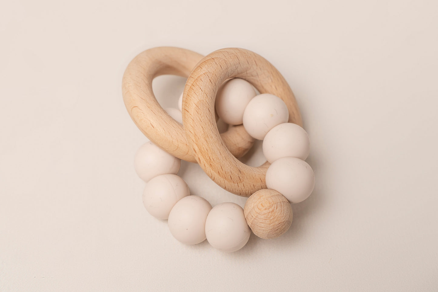 Teething Rings featuring natural wood and soft silicone for a soothing and safe teething experience. These rings have a dual-texture, easy-to-grasp design and non-toxic materials for your baby's comfort and relief. Portable and easy to clean, making teething on-the-go a breeze. Available in 4 colors, crafted with premium food-grade silicone for safety and durability.
