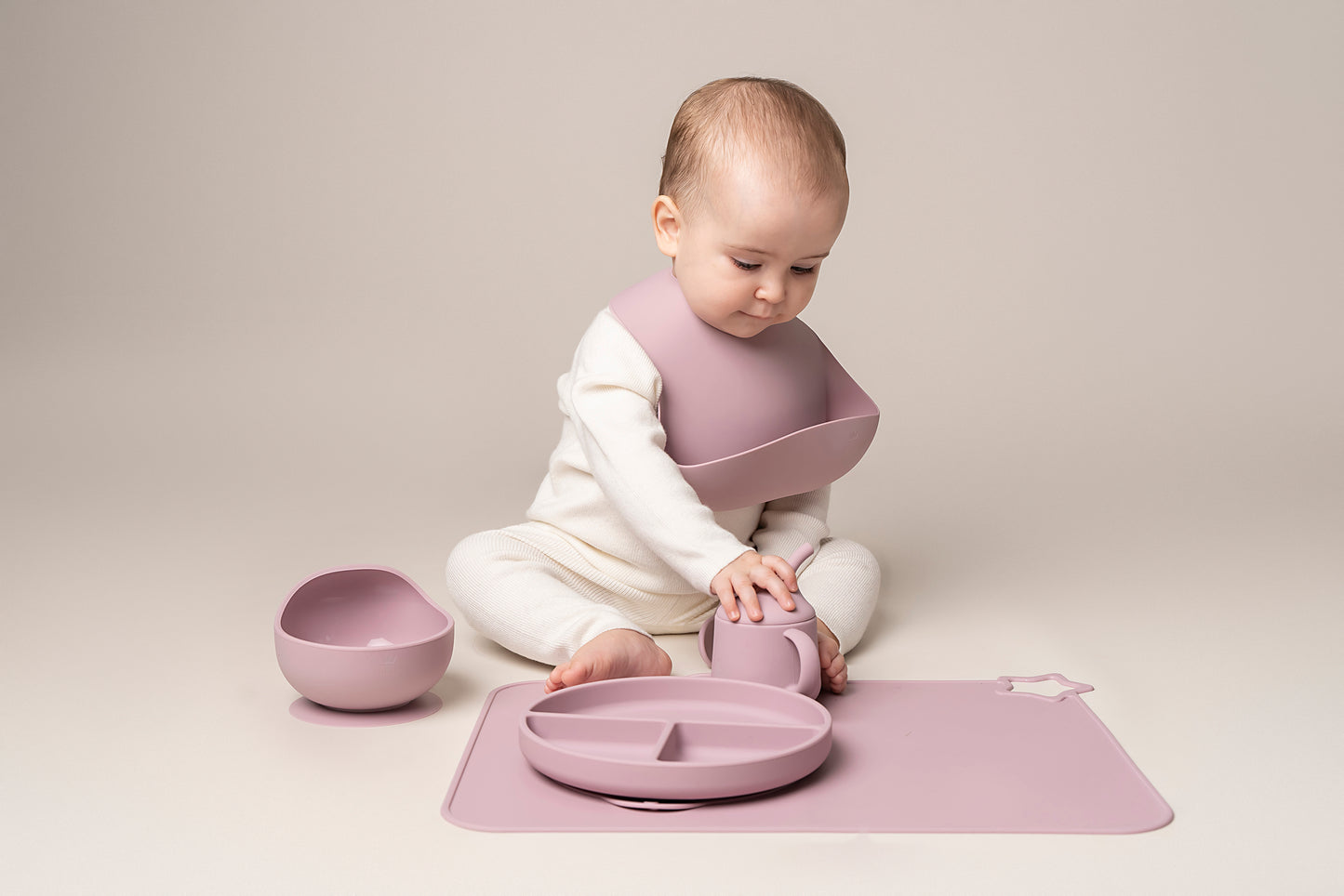 A stylish weaning set for babies and toddlers featuring unbreakable, easy-grip children’s tableware made from premium non-toxic, BPA-free, food-grade silicone. The set includes a strong suction base plate and bowl to prevent spills and distractions during meals. It's also waterproof, microwave, and dishwasher safe, offering convenience and easy cleaning. Whether introducing solids or promoting self-feeding, this baby and toddler weaning set is an essential.