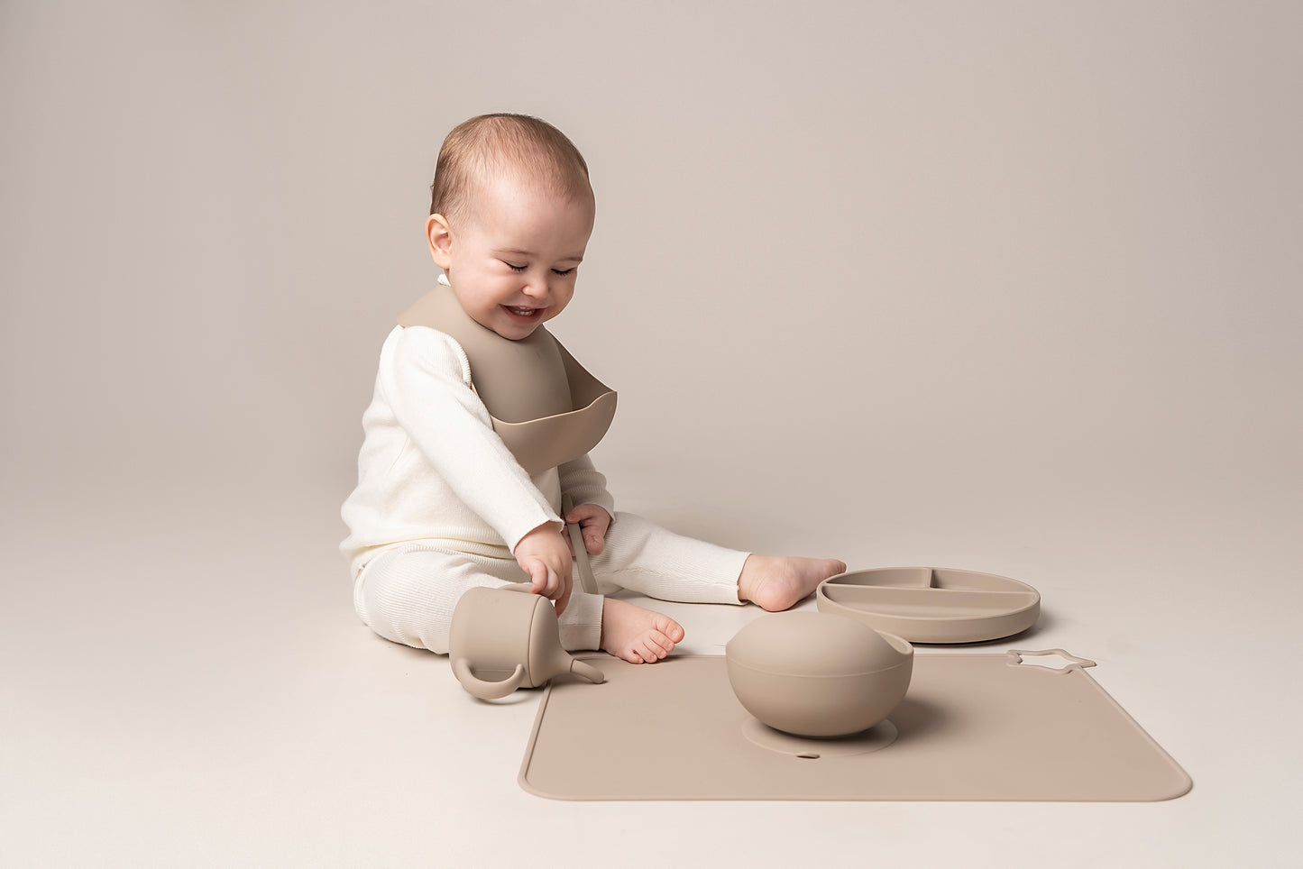 A stylish weaning set for babies and toddlers featuring unbreakable, easy-grip children’s tableware made from premium non-toxic, BPA-free, food-grade silicone. The set includes a strong suction base plate and bowl to prevent spills and distractions during meals. It's also waterproof, microwave, and dishwasher safe, offering convenience and easy cleaning. Whether introducing solids or promoting self-feeding, this baby and toddler weaning set is an essential.