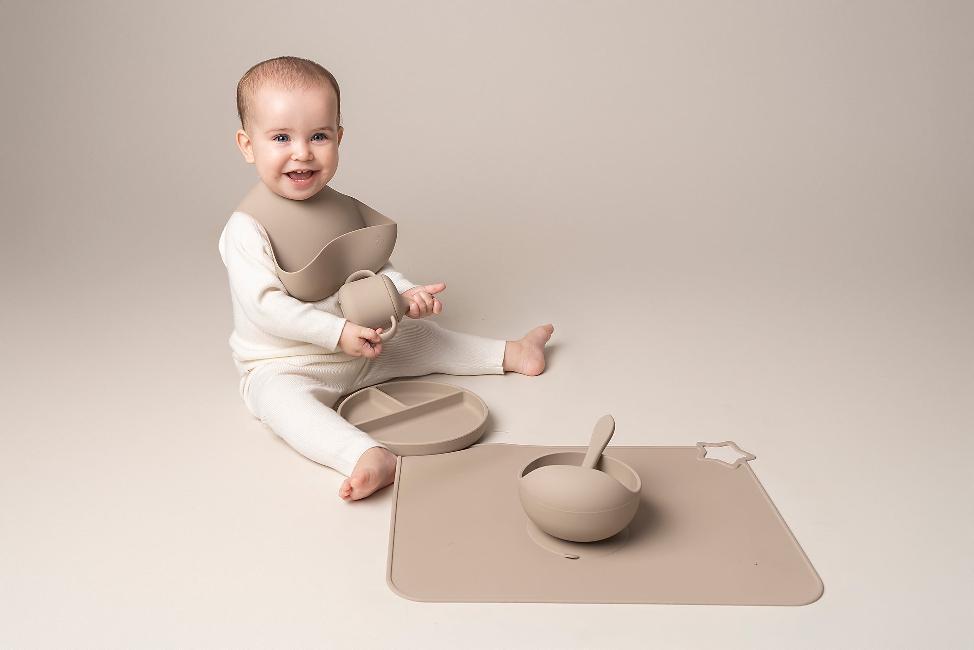 A stylish weaning set for babies and toddlers featuring unbreakable, easy-grip children’s tableware made from premium non-toxic, BPA-free, food-grade silicone. The set includes a strong suction base plate and bowl to prevent spills and distractions during meals. It's also waterproof, microwave, and dishwasher safe, offering convenience and easy cleaning. Whether introducing solids or promoting self-feeding, this baby and toddler weaning set is an essential.