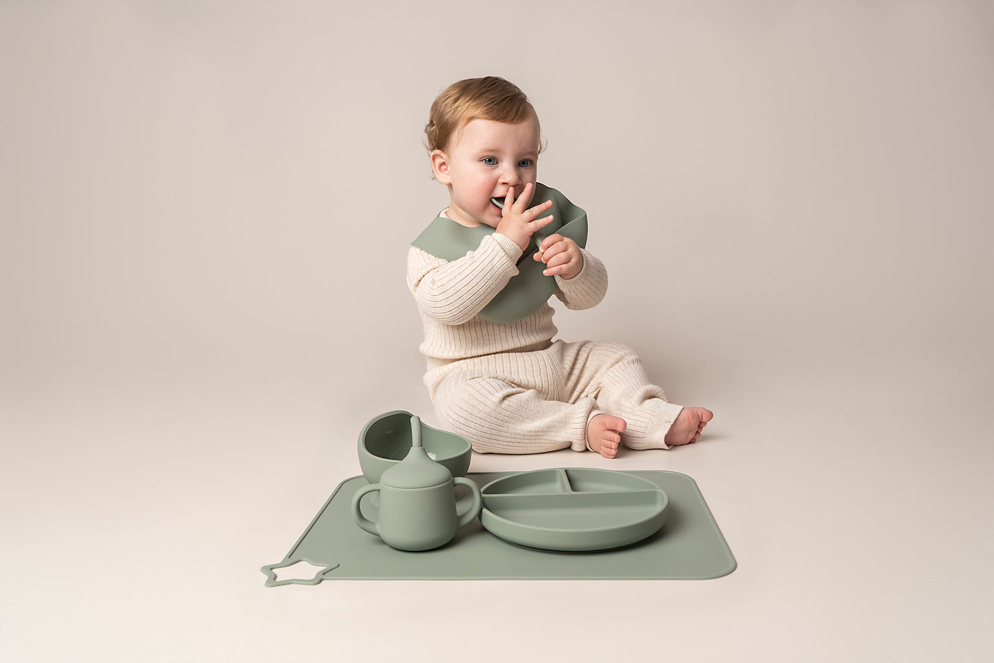 A stylish weaning set for babies and toddlers featuring unbreakable, easy-grip children’s tableware made from premium non-toxic, BPA-free, food-grade silicone. The set includes a strong suction base plate and bowl to prevent spills and distractions during meals. It's also waterproof, microwave, and dishwasher safe, offering convenience and easy cleaning. Whether introducing solids or promoting self-feeding, this baby and toddler weaning set is an essential.