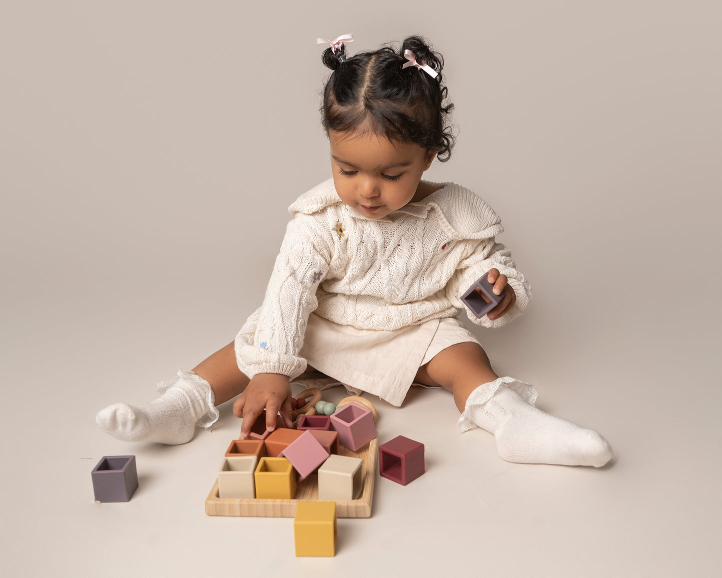 Sort & Stack Blocks for babies and toddlers, designed to spark creativity and learning. These blocks offer colour sorting, stacking, fine motor skill development, and hand-eye coordination. Easy-to-grasp for independent play and exploration. Made from food-grade silicone with a natural wood holder, these blocks are easy to clean, durable, and free from harmful chemicals, safe for teething babies. A playtime essential for every Mini!