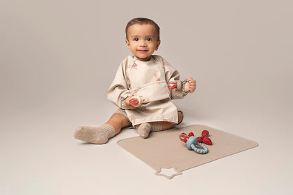 A premium, non-toxic, food-grade silicone feeding tool designed for introducing fruits and vegetables to your baby. It features an easy-grip handle for independent exploration and a silicone mesh pouch to safely hold small food pieces, preventing choking hazards. This feeder promotes healthy eating habits, self-feeding skills, and is also suitable for teething relief. BPA and phthalate-free, with unbreakable construction, waterproof, easy to clean, and safe for microwave and dishwasher use.