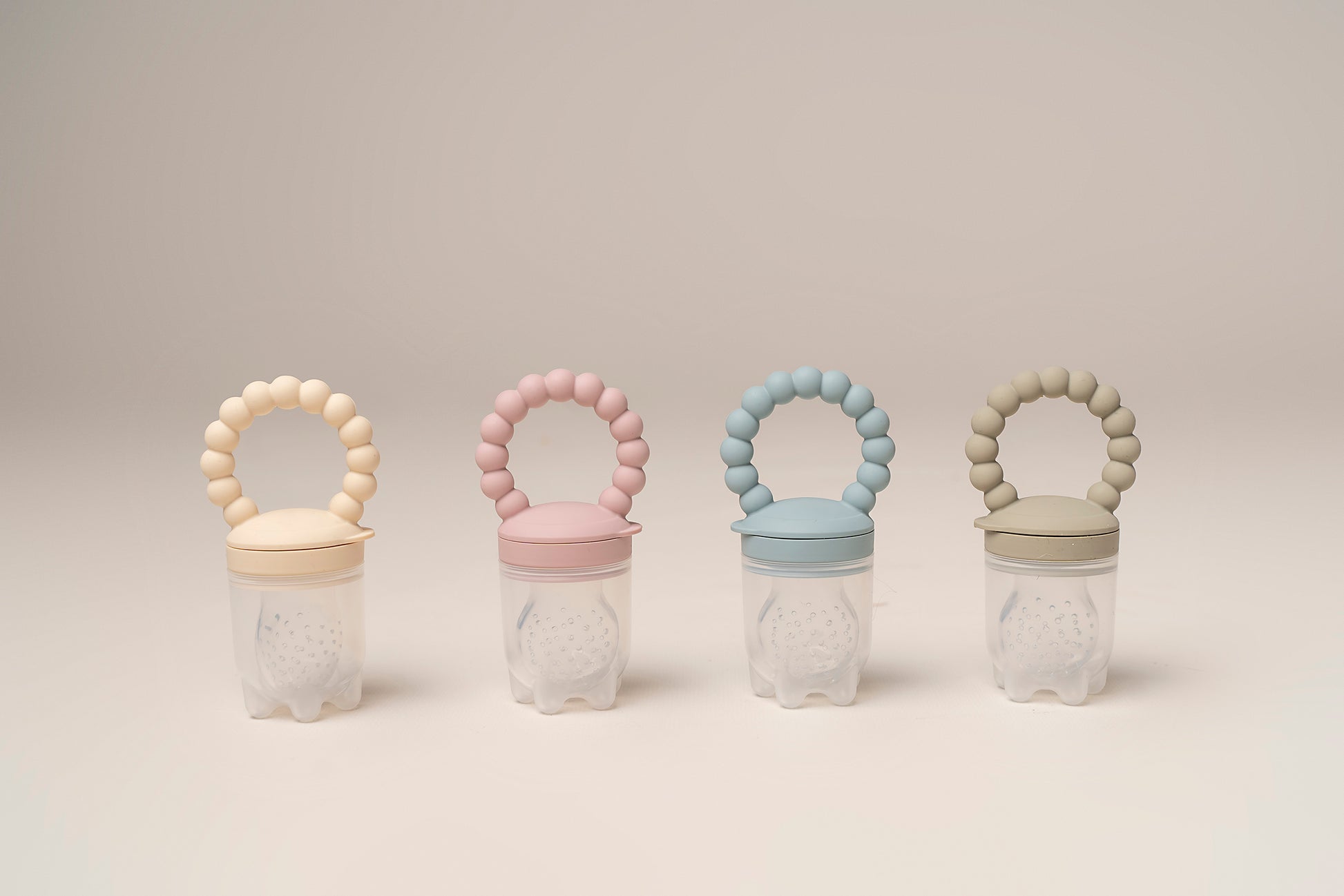 A premium, non-toxic, food-grade silicone feeding tool designed for introducing fruits and vegetables to your baby. It features an easy-grip handle for independent exploration and a silicone mesh pouch to safely hold small food pieces, preventing choking hazards. This feeder promotes healthy eating habits, self-feeding skills, and is also suitable for teething relief. BPA and phthalate-free, with unbreakable construction, waterproof, easy to clean, and safe for microwave and dishwasher use.