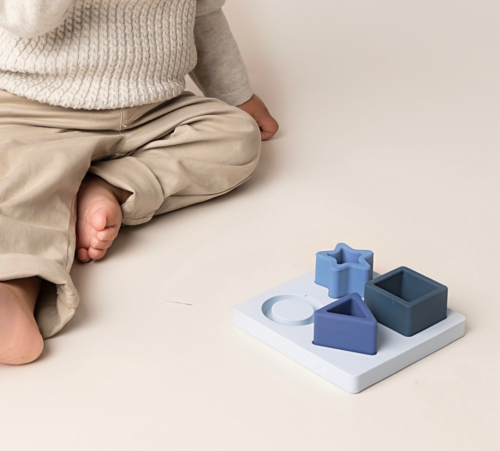 Our First Shapes Puzzle designed for little hands and curious minds. It includes chunky, easy-to-grasp pieces made from non-toxic, food-grade silicone. This puzzle encourages motor skills development, hand-eye coordination, problem-solving, and early understanding of shapes, sizes, and spatial concepts. An ideal toddler gift for fun learning. Available in 2 color options.