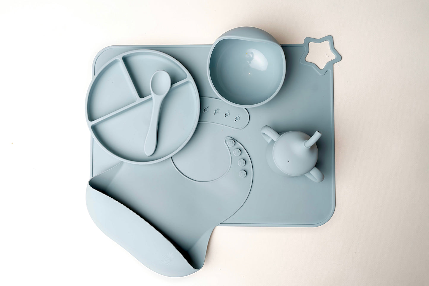 A stylish weaning set for babies and toddlers featuring unbreakable, easy-grip children’s tableware made from premium non-toxic, BPA-free, food-grade silicone. The set includes a strong suction base plate and bowl to prevent spills and distractions during meals. It's also waterproof, microwave, and dishwasher safe, offering convenience and easy cleaning. Whether introducing solids or promoting self-feeding, this baby and toddler weaning set is an essential.