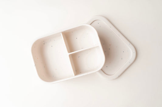 A children's Lunchbox with three compartments, designed to keep snacks and meals separate and mess-free. Its leak-proof lid ensures food remains secure and fresh. Constructed from premium, non-toxic food-grade silicone, it's easy to clean and free from harmful substances. Built for durability, this lunchbox is ideal for active children, whether at home or for on-the-go adventures. BPA and phthalate-free, with unbreakable construction, waterproof, easy to clean, and safe for microwave and dishwasher use.