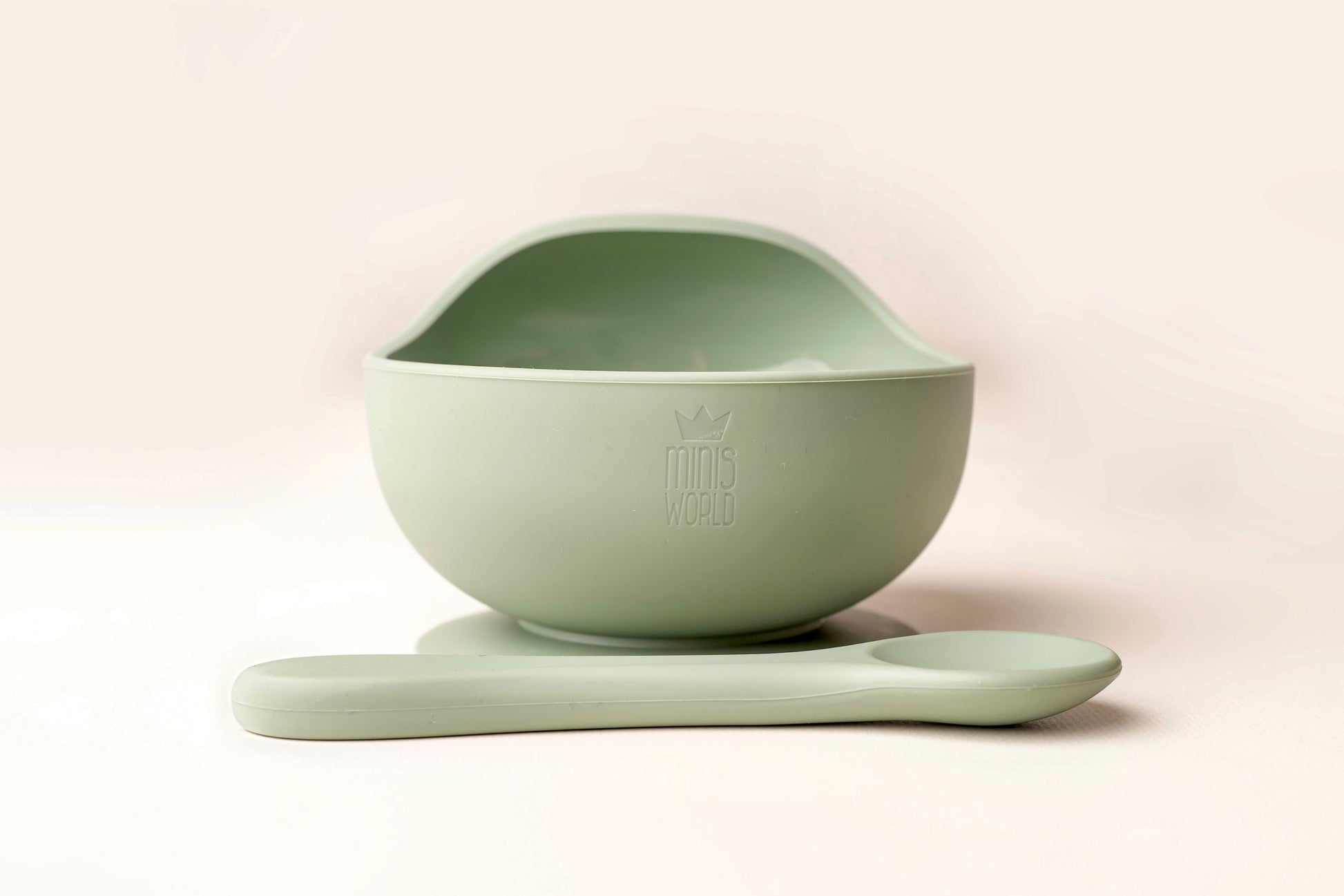A baby weaning Suction Bowl + Spoon Set designed to make weaning easier and help babies and toddlers establish mealtime independence. The set features a raised side to assist child in scooping up food independently. It has a strong suction base to prevent spills and overturned bowls. Made from BPA and Phthalate-free, non-toxic food-grade silicone, it is unbreakable, waterproof, and easy to clean. Microwave and dishwasher safe.
