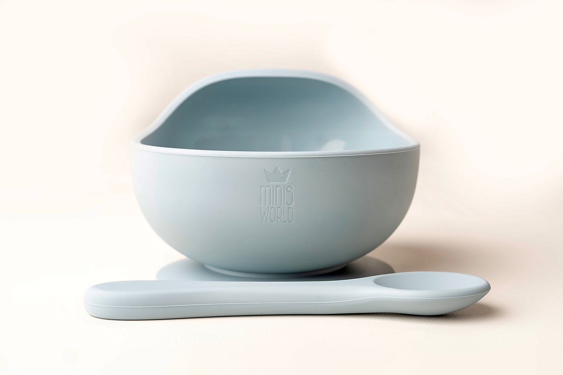 A baby weaning Suction Bowl + Spoon Set designed to make weaning easier and help babies and toddlers establish mealtime independence. The set features a raised side to assist child in scooping up food independently. It has a strong suction base to prevent spills and overturned bowls. Made from BPA and Phthalate-free, non-toxic food-grade silicone, it is unbreakable, waterproof, and easy to clean. Microwave and dishwasher safe.