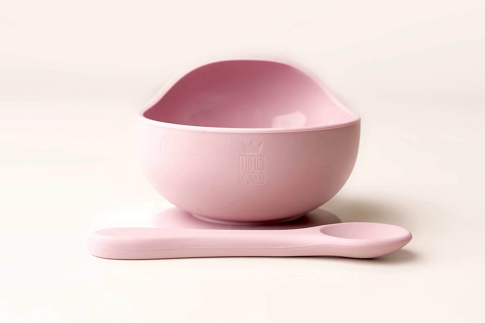 A baby weaning Suction Bowl + Spoon Set designed to make weaning easier and help babies and toddlers establish mealtime independence. The set features a raised side to assist child in scooping up food independently. It has a strong suction base to prevent spills and overturned bowls. Made from BPA and Phthalate-free, non-toxic food-grade silicone, it is unbreakable, waterproof, and easy to clean. Microwave and dishwasher safe.