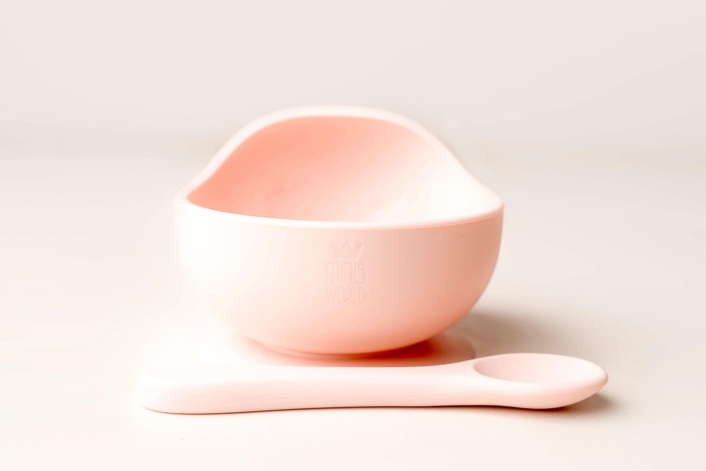 A baby weaning Suction Bowl + Spoon Set designed to make weaning easier and help babies and toddlers establish mealtime independence. The set features a raised side to assist child in scooping up food independently. It has a strong suction base to prevent spills and overturned bowls. Made from BPA and Phthalate-free, non-toxic food-grade silicone, it is unbreakable, waterproof, and easy to clean. Microwave and dishwasher safe.