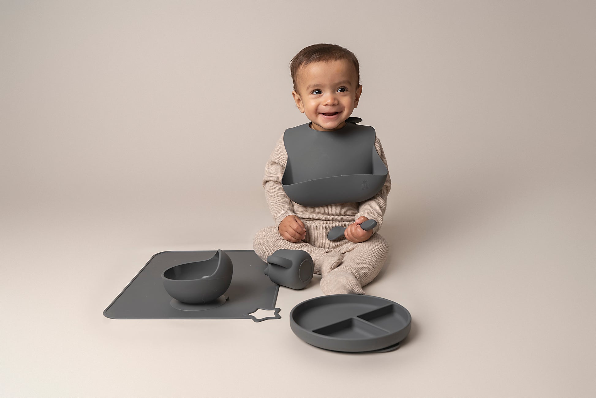 A stylish weaning set for babies and toddlers featuring unbreakable, easy-grip children’s tableware made from premium non-toxic, BPA-free, food-grade silicone. The set includes a strong suction base plate and bowl to prevent spills and distractions during meals. It's also waterproof, microwave, and dishwasher safe, offering convenience and easy cleaning. Whether introducing solids or promoting self-feeding, this baby and toddler weaning set is an essential.