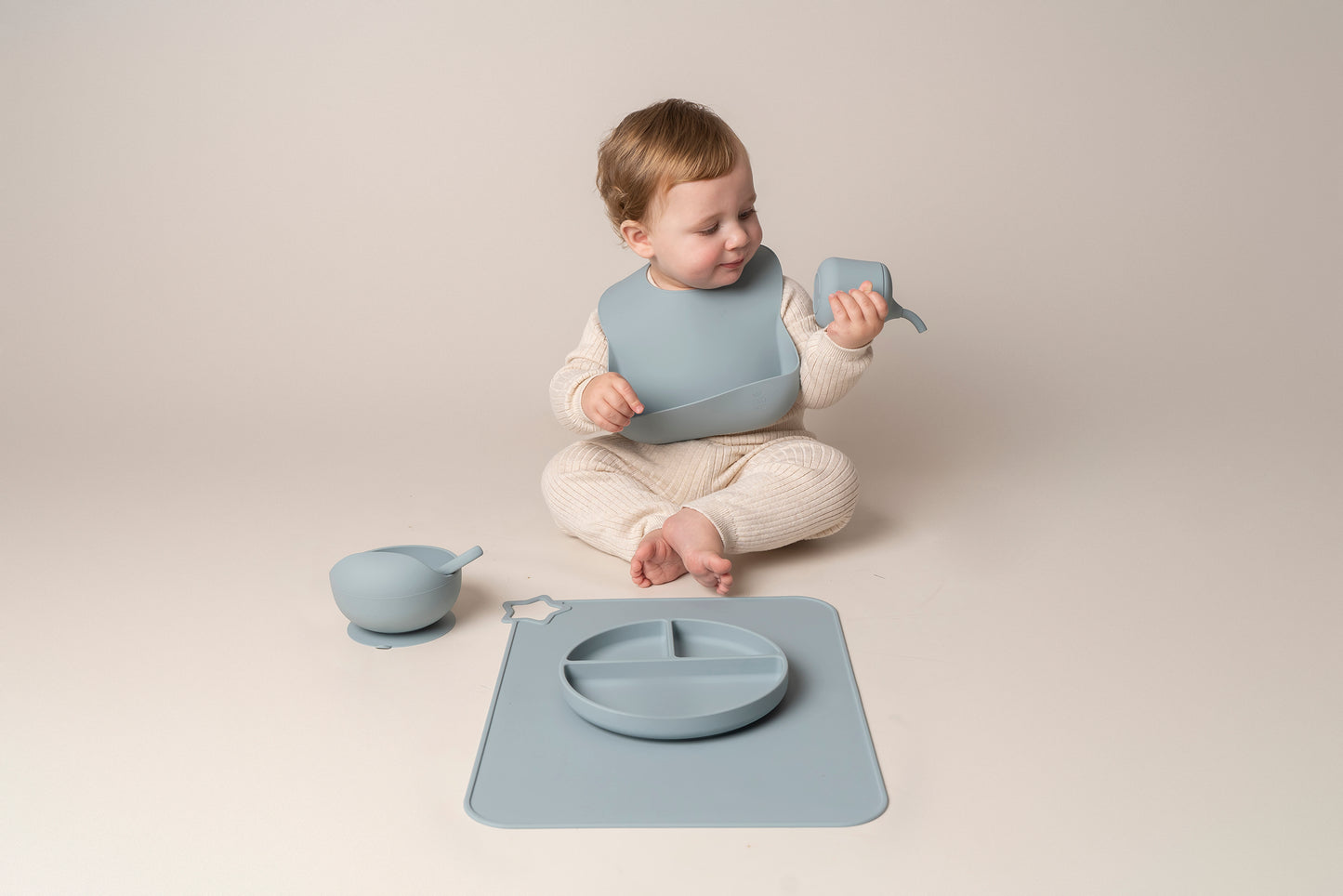 A stylish weaning set for babies and toddlers featuring unbreakable, easy-grip children’s tableware made from premium non-toxic, BPA-free, food-grade silicone. The set includes a strong suction base plate and bowl to prevent spills and distractions during meals. It's also waterproof, microwave, and dishwasher safe, offering convenience and easy cleaning. Whether introducing solids or promoting self-feeding, this baby and toddler weaning set is an essential.