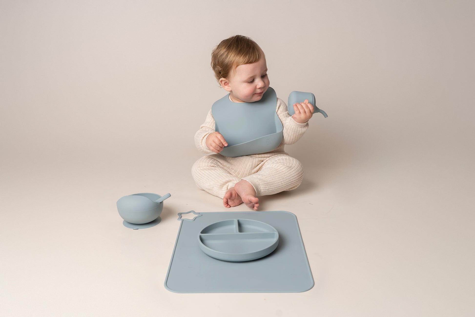 A stylish weaning set for babies and toddlers featuring unbreakable, easy-grip children’s tableware made from premium non-toxic, BPA-free, food-grade silicone. The set includes a strong suction base plate and bowl to prevent spills and distractions during meals. It's also waterproof, microwave, and dishwasher safe, offering convenience and easy cleaning. Whether introducing solids or promoting self-feeding, this baby and toddler weaning set is an essential.