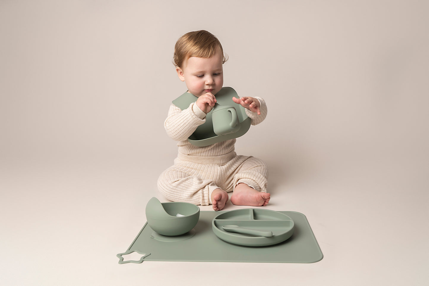 A stylish weaning set for babies and toddlers featuring unbreakable, easy-grip children’s tableware made from premium non-toxic, BPA-free, food-grade silicone. The set includes a strong suction base plate and bowl to prevent spills and distractions during meals. It's also waterproof, microwave, and dishwasher safe, offering convenience and easy cleaning. Whether introducing solids or promoting self-feeding, this baby and toddler weaning set is an essential. 