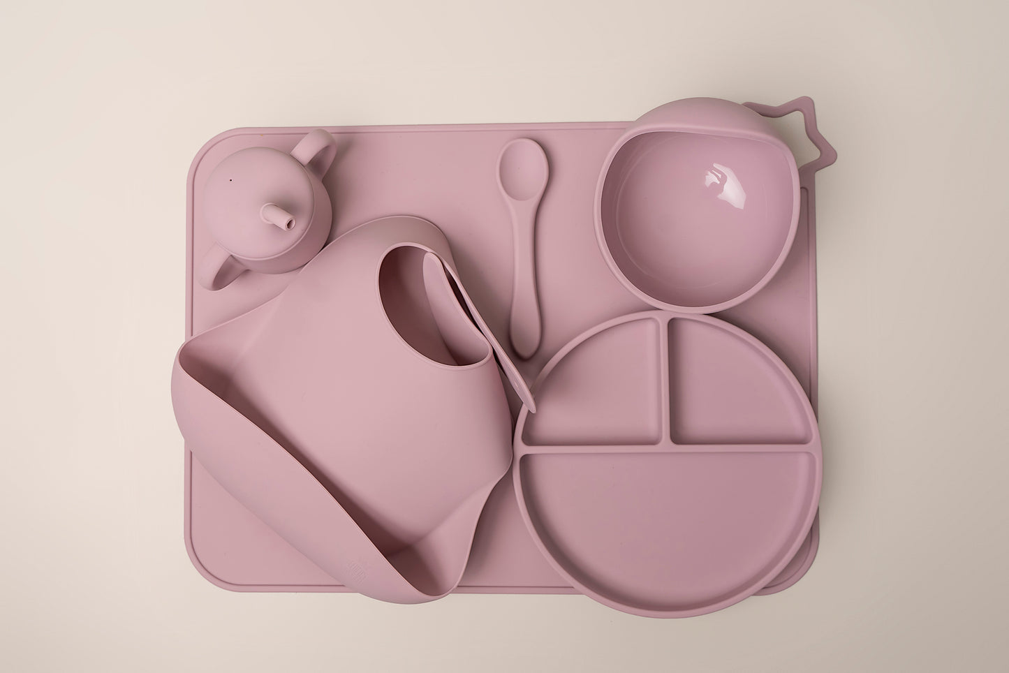 A stylish weaning set for babies and toddlers featuring unbreakable, easy-grip children’s tableware made from premium non-toxic, BPA-free, food-grade silicone. The set includes a strong suction base plate and bowl to prevent spills and distractions during meals. It's also waterproof, microwave, and dishwasher safe, offering convenience and easy cleaning. Whether introducing solids or promoting self-feeding, this baby and toddler weaning set is an essential.
