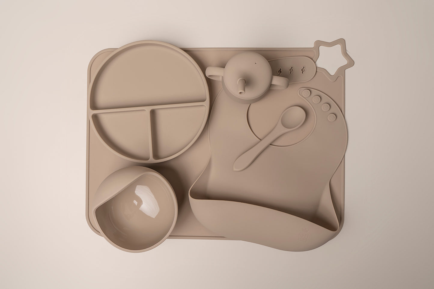 A stylish weaning set for babies and toddlers featuring unbreakable, easy-grip children’s tableware made from premium non-toxic, BPA-free, food-grade silicone. The set includes a strong suction base plate and bowl to prevent spills and distractions during meals. It's also waterproof, microwave, and dishwasher safe, offering convenience and easy cleaning. Whether introducing solids or promoting self-feeding, this baby and toddler weaning set is an essential.